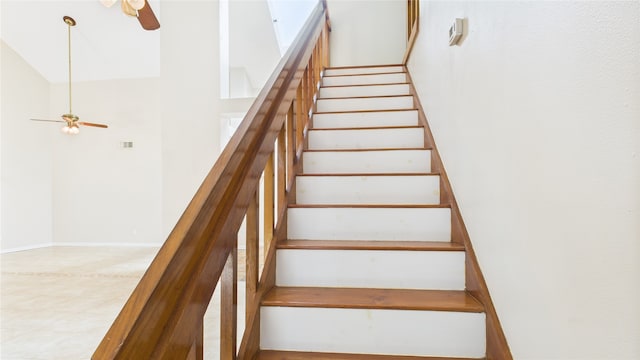 2026 Ashford Hollow Ln, Houston, TX 77077 - staircase featuring a ceiling fan and a towering ceiling