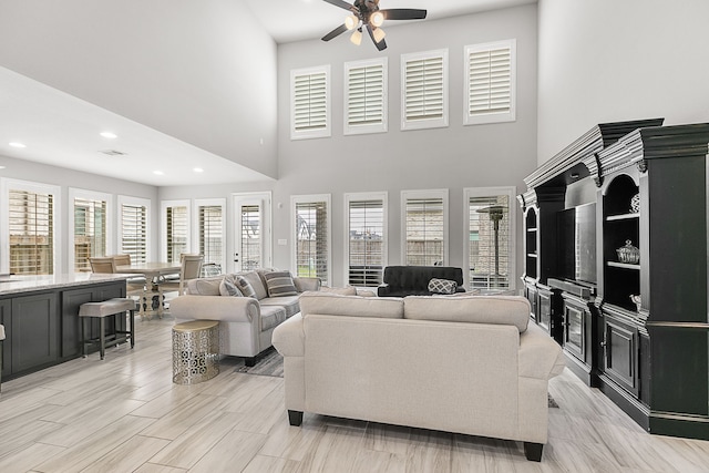 living room with recessed lighting and ceiling fan