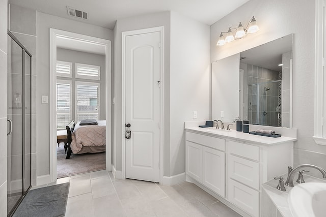 full bathroom with vanity, visible vents, a shower stall, tile patterned floors, and a washtub