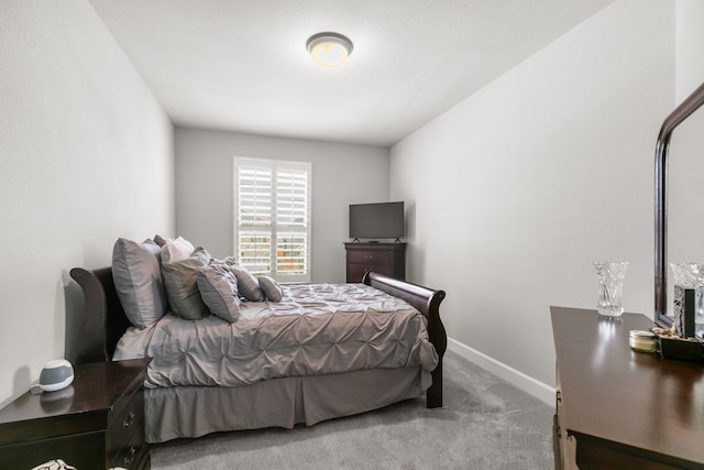 carpeted bedroom with baseboards