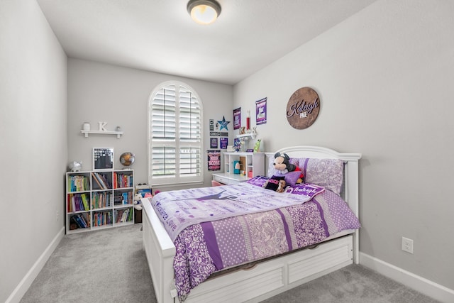 carpeted bedroom with baseboards