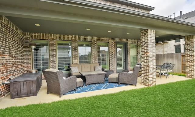 view of patio with outdoor lounge area and fence