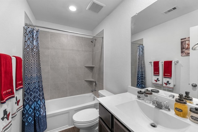 full bathroom featuring visible vents, toilet, shower / tub combo with curtain, and vanity