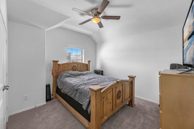 carpeted bedroom featuring baseboards, a ceiling fan, and vaulted ceiling