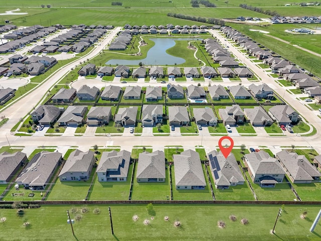 aerial view with a residential view and a water view