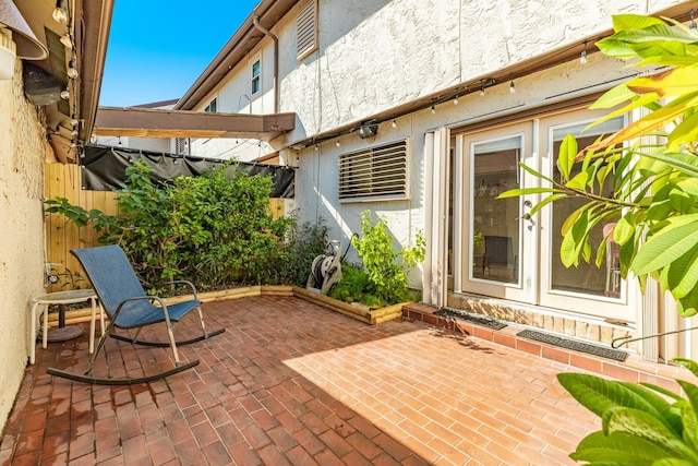 view of patio / terrace featuring fence