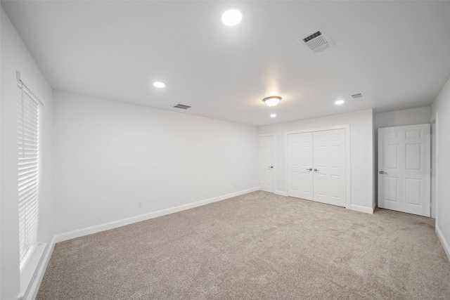 interior space featuring recessed lighting, visible vents, and baseboards