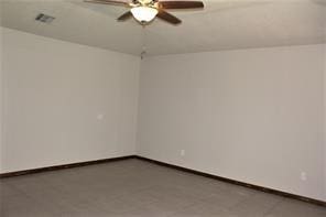 unfurnished room featuring baseboards and ceiling fan