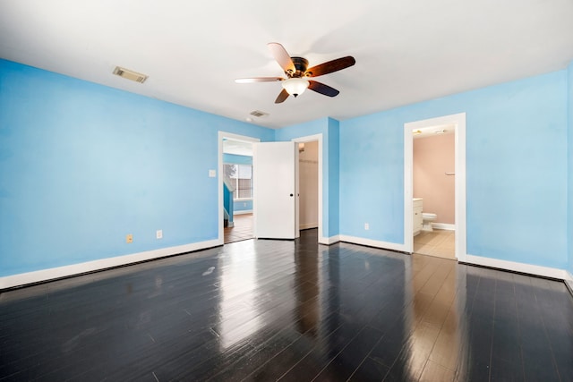 unfurnished bedroom featuring visible vents, baseboards, and wood finished floors