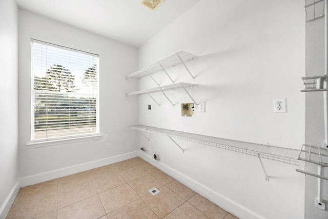 washroom featuring light tile patterned floors, visible vents, laundry area, electric dryer hookup, and washer hookup