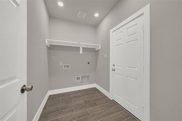 clothes washing area featuring baseboards, wood tiled floor, washer hookup, laundry area, and electric dryer hookup