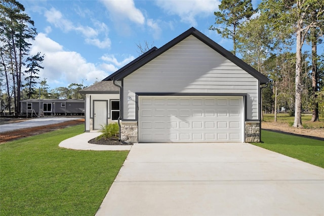 ranch-style house featuring a garage, stone siding, concrete driveway, and a front yard