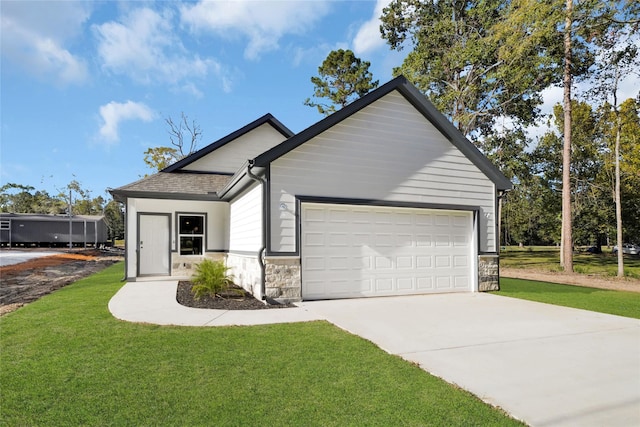 view of front facade featuring stone siding, an attached garage, and a front yard