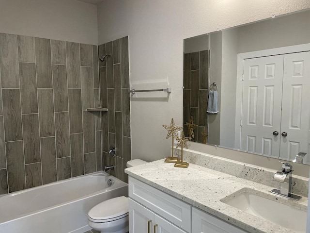 bathroom featuring toilet, vanity, and shower / tub combination