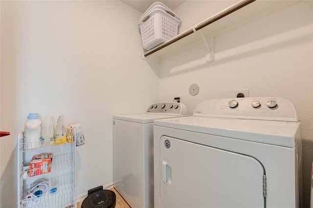 laundry room featuring independent washer and dryer and laundry area