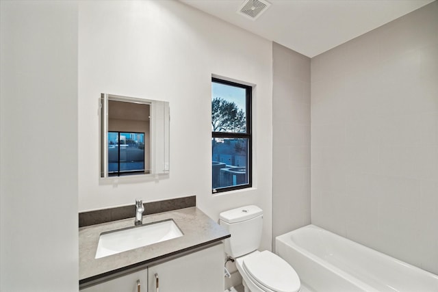 bathroom with visible vents, toilet, and vanity