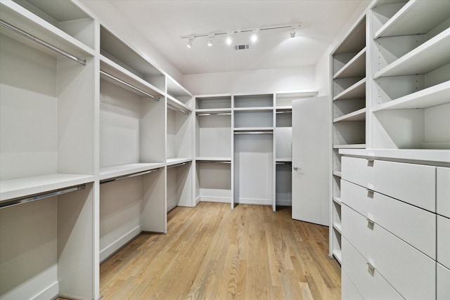 walk in closet featuring visible vents and light wood-style floors