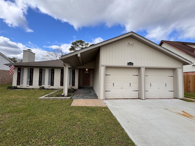 ranch-style house featuring a front lawn, a chimney, a garage, and concrete driveway