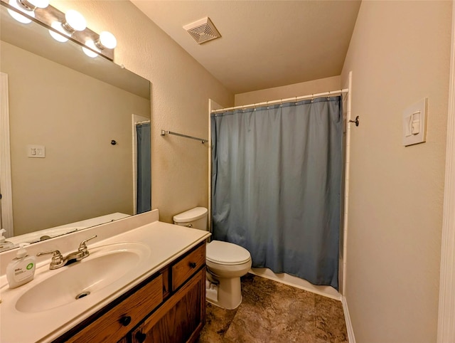 full bathroom featuring visible vents, toilet, and vanity