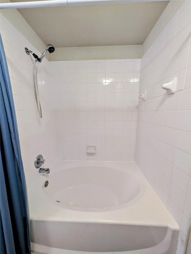 full bath featuring shower / bath combo with shower curtain