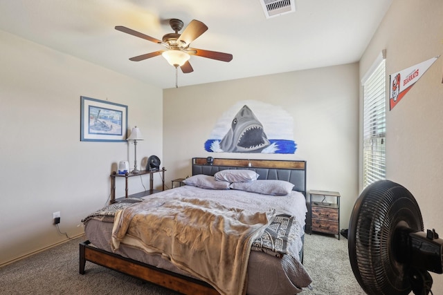 bedroom with visible vents, carpet floors, and a ceiling fan