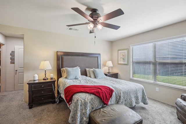 bedroom featuring carpet, visible vents, and ceiling fan