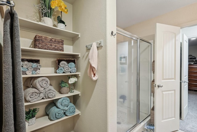 bathroom featuring a stall shower