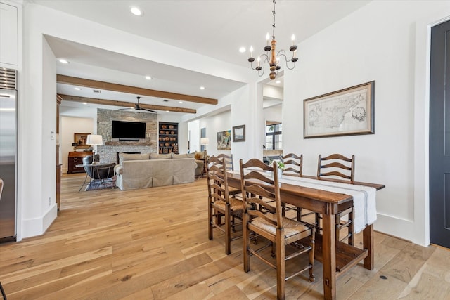 dining area featuring baseboards, beam ceiling, a fireplace, recessed lighting, and light wood-style floors