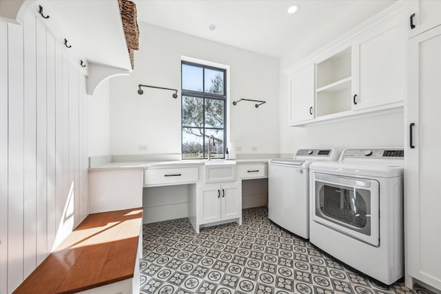 laundry area with light tile patterned flooring, cabinet space, recessed lighting, a sink, and washer and dryer