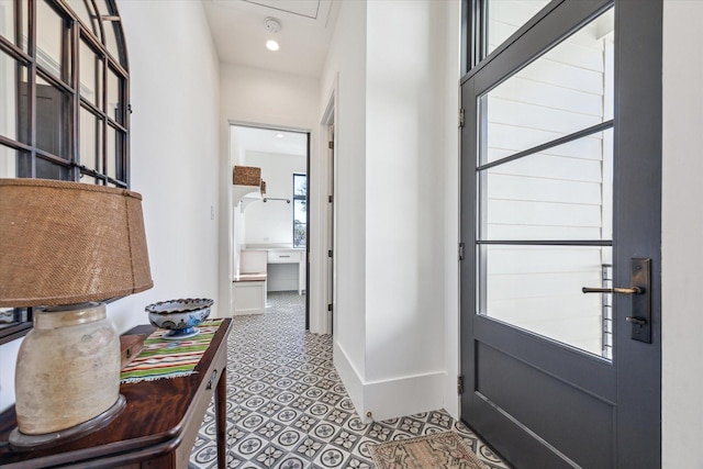 entryway featuring recessed lighting and baseboards