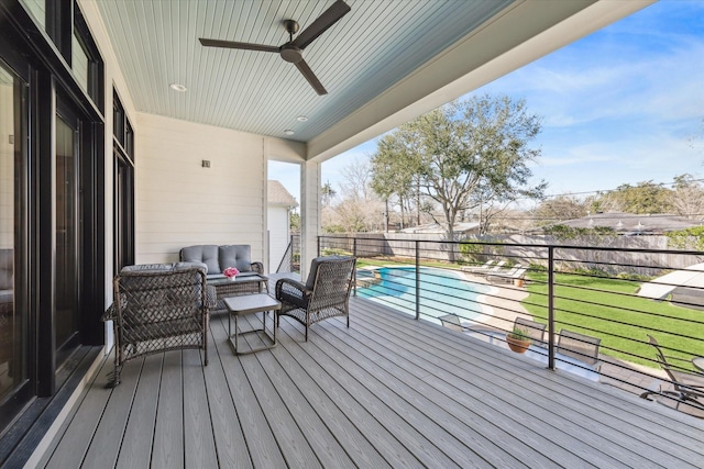 deck featuring a fenced in pool, an outdoor living space, a yard, a fenced backyard, and ceiling fan