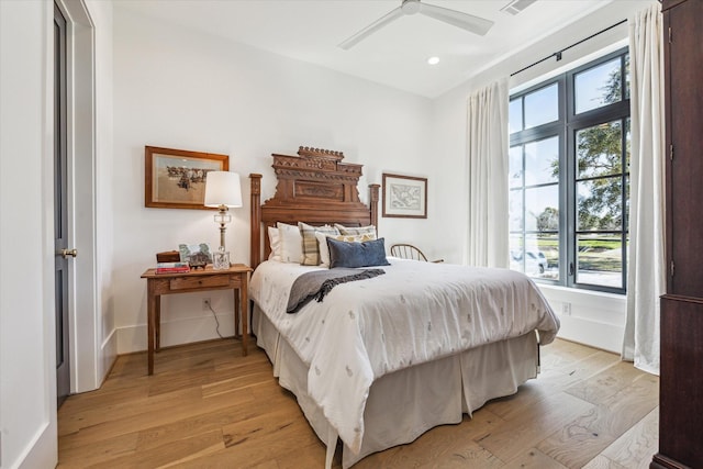 bedroom featuring recessed lighting, baseboards, light wood-style flooring, and a ceiling fan