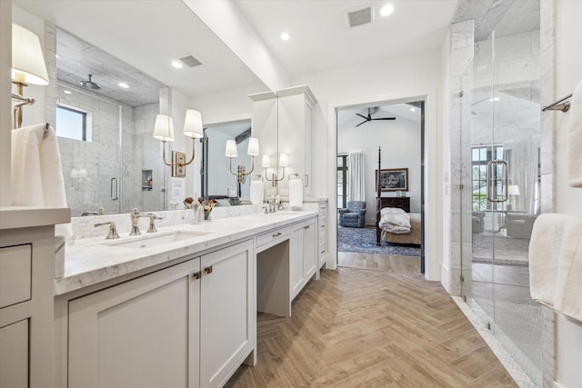 ensuite bathroom with a sink, visible vents, double vanity, and a shower stall