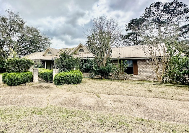 view of front of property featuring metal roof