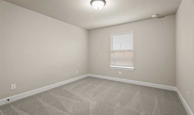 13109 Mundet Dr, Houston, TX 77047 - spare room featuring carpet flooring and a smoke detector