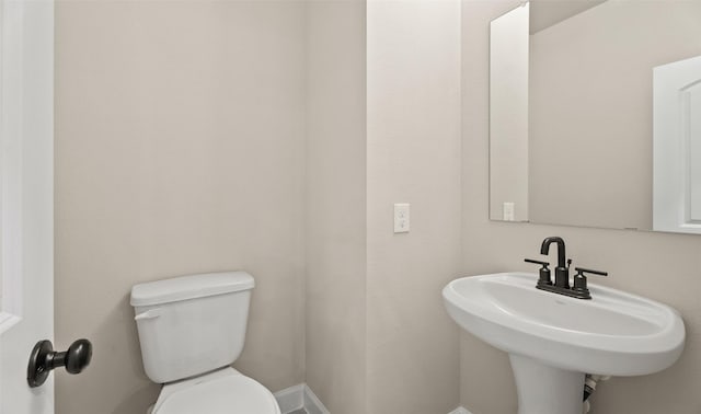 13109 Mundet Dr, Houston, TX 77047 - half bathroom with a sink and toilet