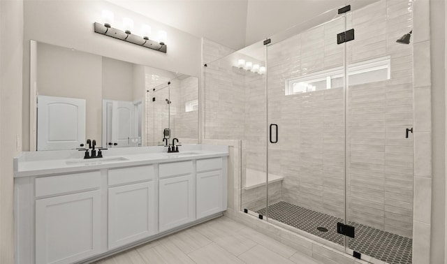 13109 Mundet Dr, Houston, TX 77047 - full bath featuring double vanity, a shower stall, and tile patterned flooring