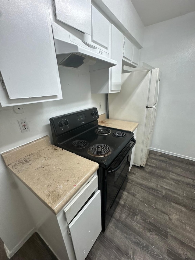 kitchen with under cabinet range hood, dark wood finished floors, light countertops, electric range, and white cabinetry