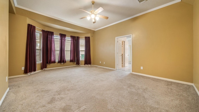 unfurnished room featuring visible vents, carpet floors, crown molding, baseboards, and ceiling fan