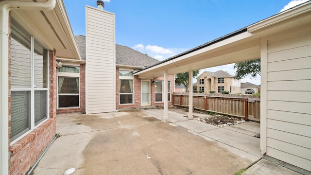 view of patio / terrace featuring fence