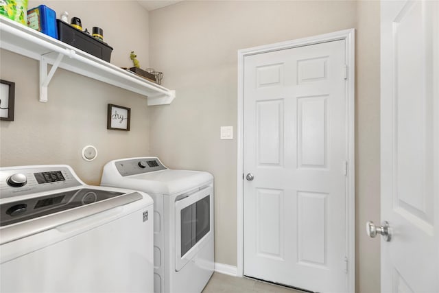 washroom featuring independent washer and dryer and laundry area