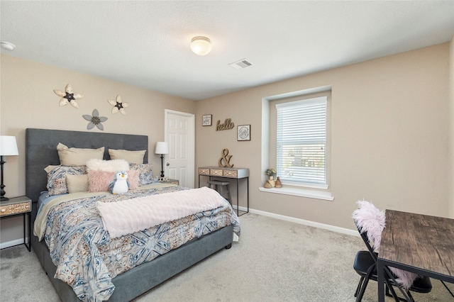 carpeted bedroom featuring visible vents and baseboards