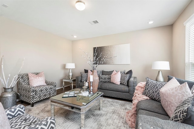 living room featuring recessed lighting, wood finished floors, visible vents, and baseboards