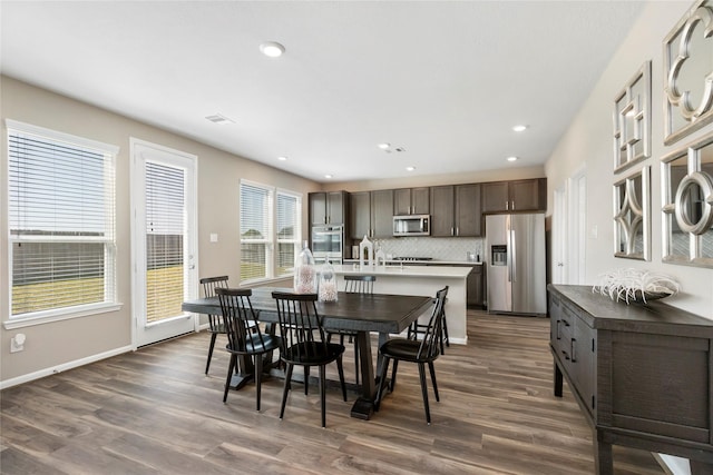 dining area with recessed lighting, visible vents, baseboards, and dark wood-type flooring