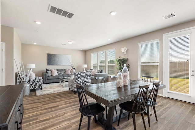 dining area featuring recessed lighting, visible vents, and wood finished floors