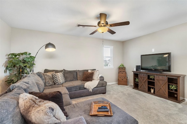 carpeted living room with baseboards and ceiling fan