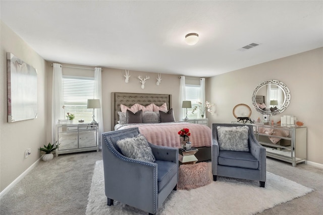 bedroom featuring visible vents, baseboards, and carpet flooring