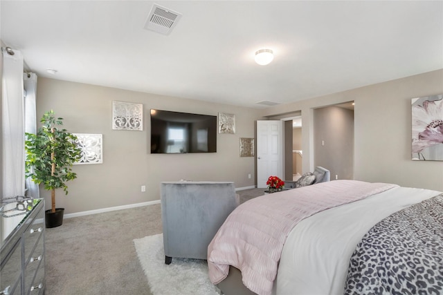 carpeted bedroom with visible vents and baseboards