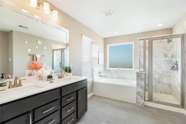 full bathroom with a sink, visible vents, and a garden tub