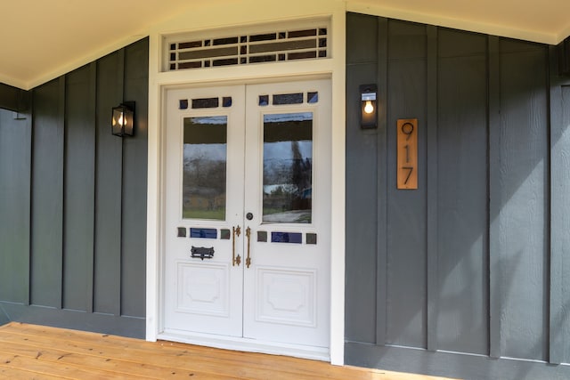 doorway to property with french doors and board and batten siding